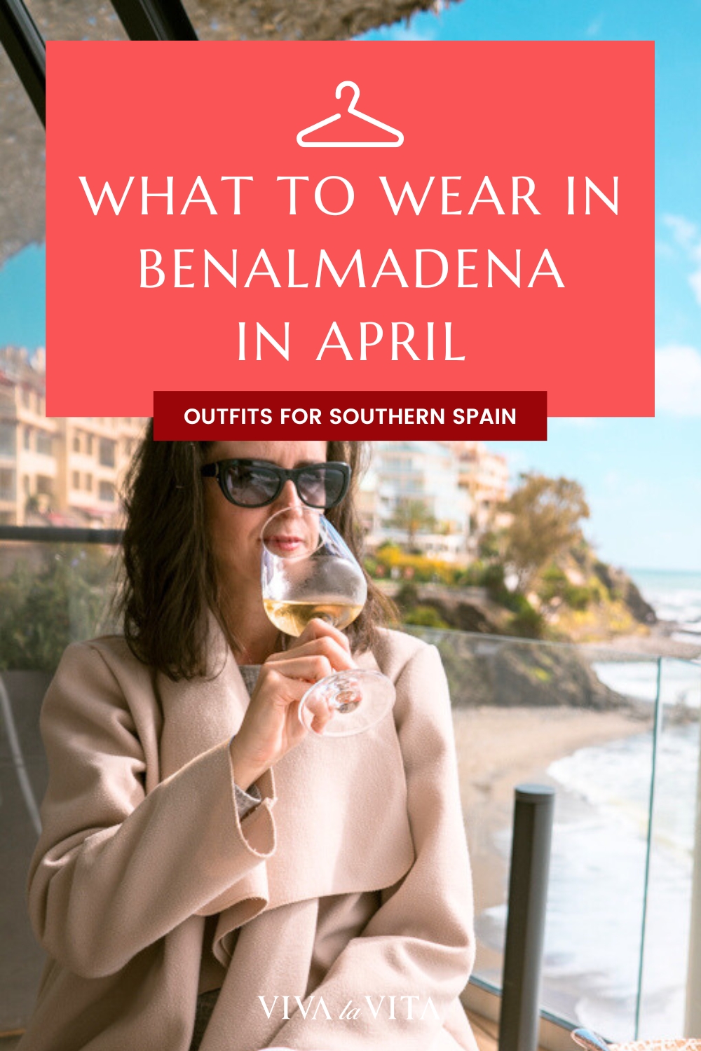 Pinterest image showing a woman drinking wine with a warm coat in a restaurant, with a headline: what to wear in Benalmadena in April - outfits for Southern Spain