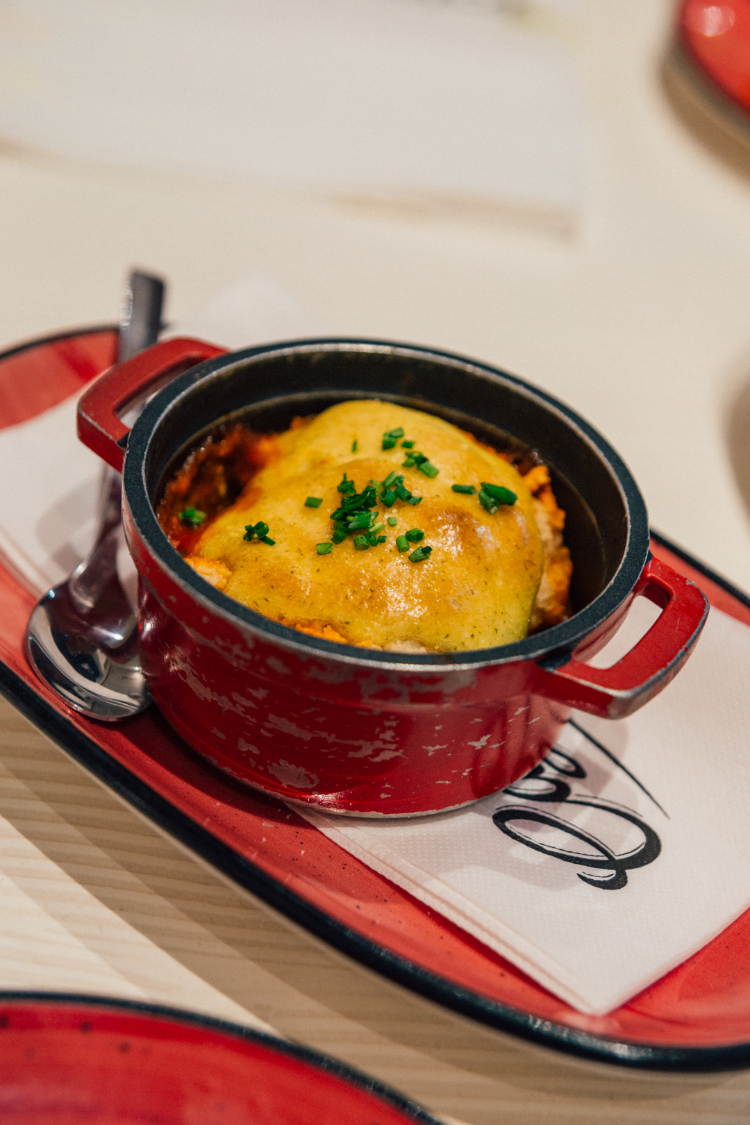 Baked cod in tomato sauce at Casa Blanca Restaurant, Marbella