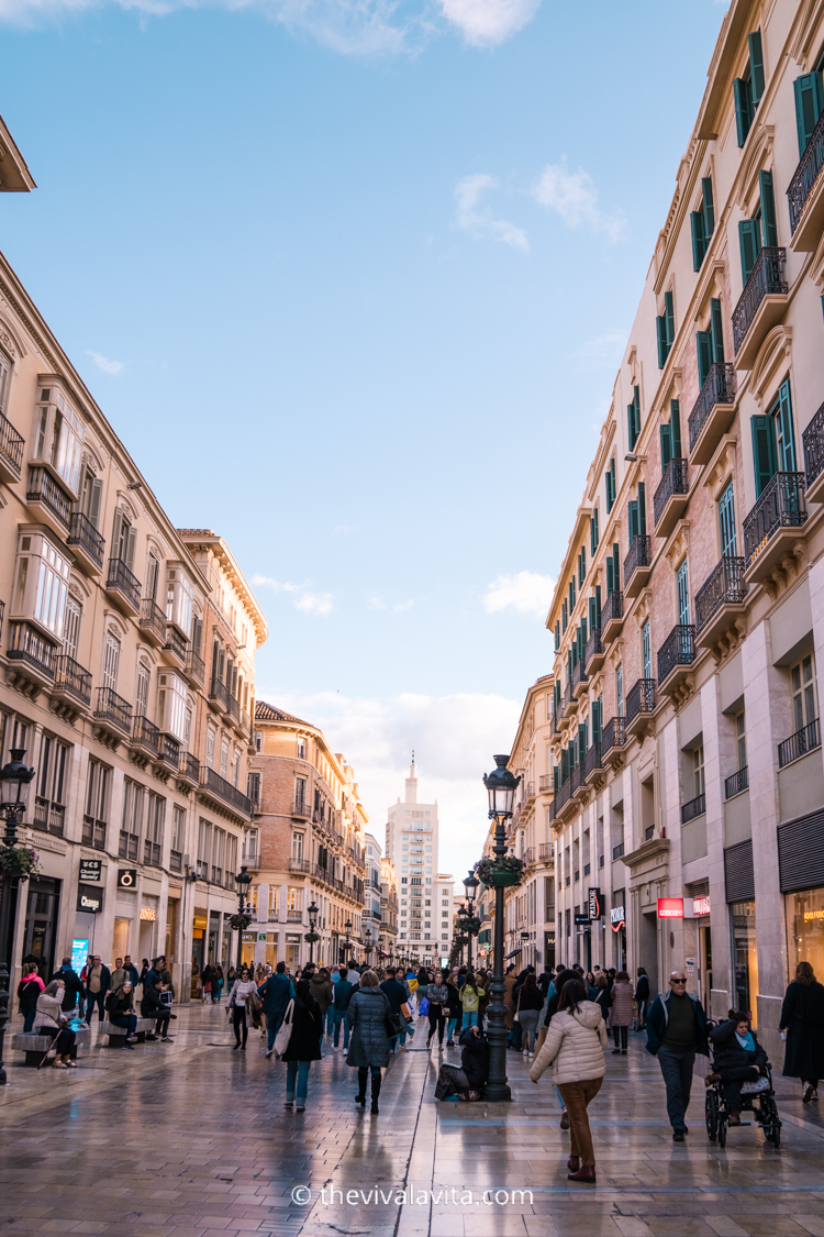 people walking on the street of Calle Larios in Malaga, Southern Spain