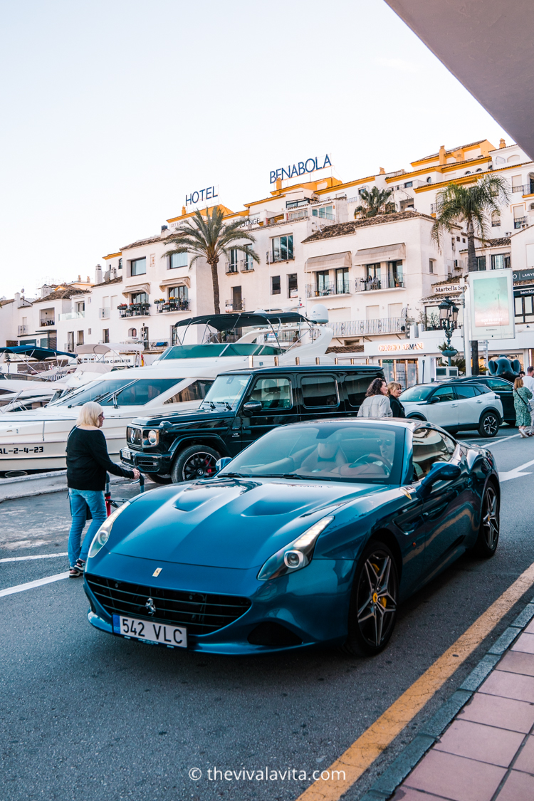 luxury cars on a street next to Puerto Banus marina in Marbella, Southern Spain