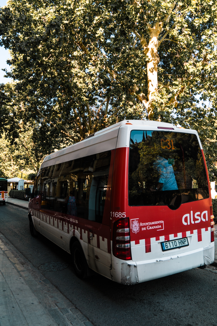 Local C31 red minibus in Granada, Spain.