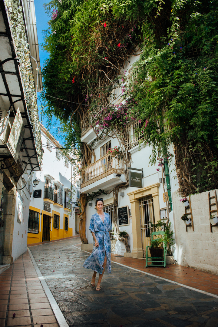 A woman walking through the streets of Marbella old town
