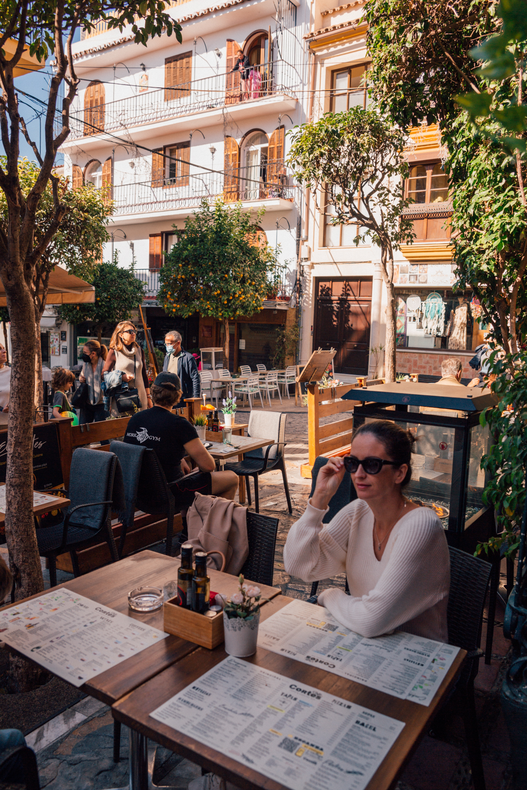 people sitting in a cafe in Marbella old town, Southern Spain